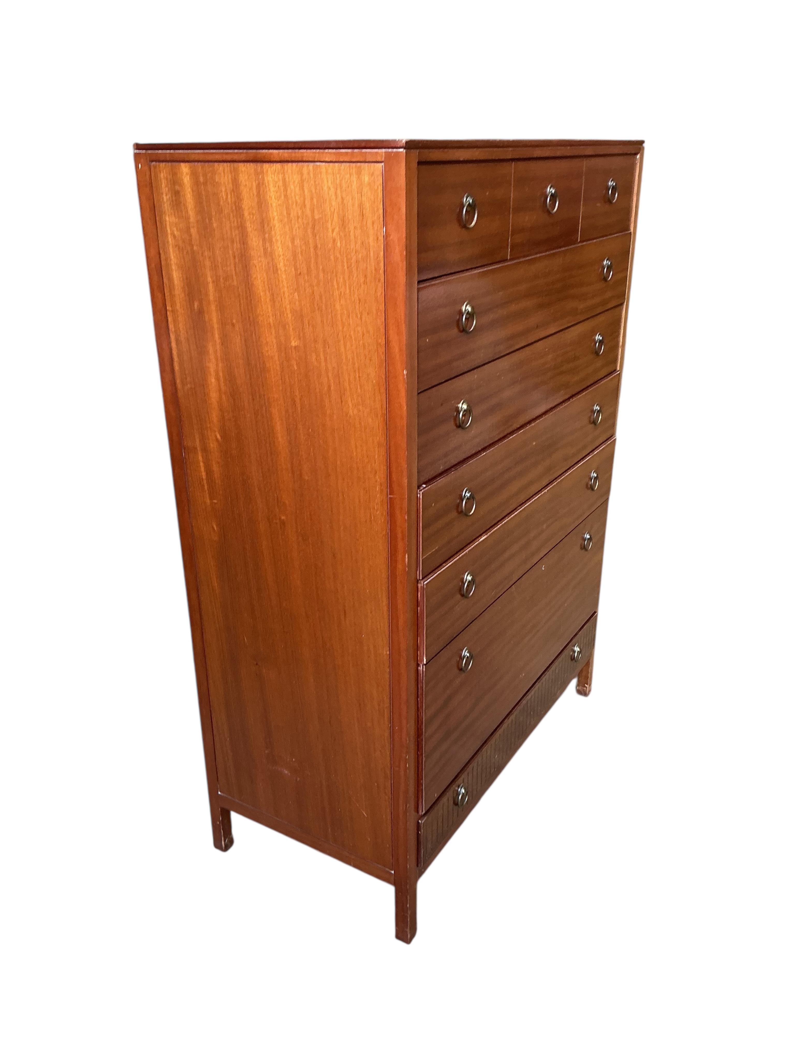 A Loughborough For Heals brass inlaid teak four piece bedroom suite comprising: triple wardrobe, width 120cm, depth 54cm, height 176cm, two chests of drawers and a toilet mirror